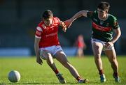 16 May 2025; Tadhg McDonnell of Louth in action against Cathal Keaveney of Mayo during the Dalata Hotel Group GAA Football All-Ireland U20 Championship semi-final match between Mayo and Louth at Glennon Brothers Pearse Park in Longford. Photo by Stephen Marken/Sportsfile