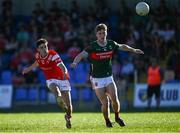 16 May 2025; Shane Lennon of Louth in action against John McMonagle of Mayo during the Dalata Hotel Group GAA Football All-Ireland U20 Championship semi-final match between Mayo and Louth at Glennon Brothers Pearse Park in Longford. Photo by Stephen Marken/Sportsfile