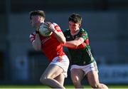 16 May 2025; Seán Callaghan of Louth in action against Cathal Keaveney of Mayo during the Dalata Hotel Group GAA Football All-Ireland U20 Championship semi-final match between Mayo and Louth at Glennon Brothers Pearse Park in Longford. Photo by Stephen Marken/Sportsfile