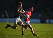 16 May 2025; Conor McCríosta of Louth is fouled by John McMonagle of Mayo during the Dalata Hotel Group GAA Football All-Ireland U20 Championship semi-final match between Mayo and Louth at Glennon Brothers Pearse Park in Longford. Photo by Stephen Marken/Sportsfile
