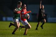 16 May 2025; Conor McCríosta of Louth is fouled by John McMonagle of Mayo during the Dalata Hotel Group GAA Football All-Ireland U20 Championship semi-final match between Mayo and Louth at Glennon Brothers Pearse Park in Longford. Photo by Stephen Marken/Sportsfile
