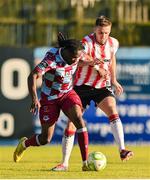 16 May 2025; Thomas Oluwa of Drogheda United in action against Hayden Cann of Derry City during the SSE Airtricity Men's Premier Division match between Drogheda United and Derry City at Sullivan & Lambe Park in Drogheda, Louth. Photo by Ramsey Cardy/Sportsfile
