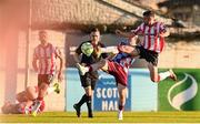 16 May 2025; Michael Duffy of Derry City in action against Warren Davis of Drogheda United during the SSE Airtricity Men's Premier Division match between Drogheda United and Derry City at Sullivan & Lambe Park in Drogheda, Louth. Photo by Ramsey Cardy/Sportsfile