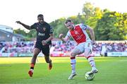 16 May 2025; Sean Hoare of St Patrick's Athletic in action against Djenairo Daniels of Cork City during the SSE Airtricity Men's Premier Division match between St Patrick's Athletic and Cork City at Richmond Park in Dublin. Photo by Sam Barnes/Sportsfile