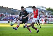 16 May 2025; Kian Leavy of St Patrick's Athletic in action against Harry Nevin of Cork City during the SSE Airtricity Men's Premier Division match between St Patrick's Athletic and Cork City at Richmond Park in Dublin. Photo by Sam Barnes/Sportsfile