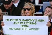16 May 2025; Caroline O'Mahony, mother of Peter O'Mahony of Munster, holds up a sign during the United Rugby Championship match between Munster and Benetton at Virgin Media Park in Cork. Photo by Brendan Moran/Sportsfile