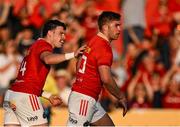 16 May 2025; Jack Crowley of Munster, right, celebrates with teammate Calvin Nash after scoring their side's first try during the United Rugby Championship match between Munster and Benetton at Virgin Media Park in Cork. Photo by Brendan Moran/Sportsfile