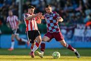 16 May 2025; Ryan Brennan of Drogheda United in action against Adam O'Reilly of Derry City during the SSE Airtricity Men's Premier Division match between Drogheda United and Derry City at Sullivan & Lambe Park in Drogheda, Louth. Photo by Ramsey Cardy/Sportsfile