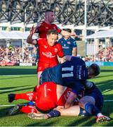 16 May 2025; Ulster players, Nathan Doak and Michael Lowry celebrate with teammate Werner Kok after scoring their side's first try during the United Rugby Championship match between Edinburgh and Ulster at Hive Stadium in Edinburgh, Scotland. Photo by Paul Devlin/Sportsfile