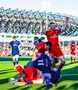16 May 2025; Ulster players, Nathan Doak and Michael Lowry celebrate with teammate Werner Kok after scoring their side's first try during the United Rugby Championship match between Edinburgh and Ulster at Hive Stadium in Edinburgh, Scotland. Photo by Paul Devlin/Sportsfile