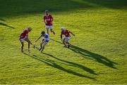 16 May 2025; Cormac Spain of Waterford in action against Cork players, from left, Ruairc Donovan, Cormac Deane and Darragh Heavin during the Electric Ireland GAA Hurling Munster Minor Championship final match between Cork and Waterford at FBD Semple Stadium in Thurles, Tipperary. Photo by Piaras Ó Mídheach/Sportsfile