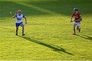 16 May 2025; Daragh Murphy of Waterford in action against Cormac Deane of Cork during the Electric Ireland GAA Hurling Munster Minor Championship final match between Cork and Waterford at FBD Semple Stadium in Thurles, Tipperary. Photo by Piaras Ó Mídheach/Sportsfile