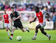 16 May 2025; Al-Amin Kazeem of St Patrick's Athletic in action against Cathal O'Sullivan of Cork City during the SSE Airtricity Men's Premier Division match between St Patrick's Athletic and Cork City at Richmond Park in Dublin. Photo by Sam Barnes/Sportsfile