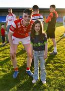 16 May 2025; James Maguire of Louth with his cousin Evie Grace Maguire, age 7, from Monaghan after his side's victory in the Dalata Hotel Group GAA Football All-Ireland U20 Championship semi-final match between Mayo and Louth at Glennon Brothers Pearse Park in Longford. Photo by Stephen Marken/Sportsfile