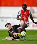 16 May 2025; Al-Amin Kazeem of St Patrick's Athletic in action against Cathal O'Sullivan of Cork City during the SSE Airtricity Men's Premier Division match between St Patrick's Athletic and Cork City at Richmond Park in Dublin. Photo by Sam Barnes/Sportsfile