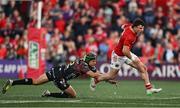 16 May 2025; Calvin Nash of Munster is tackled by Ignacio Brex of Benetton Treviso during the United Rugby Championship match between Munster and Benetton at Virgin Media Park in Cork. Photo by Brendan Moran/Sportsfile