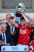 16 May 2025; Cork captain Bobby Carroll lifts The John Doyle Cup after his side's victory in the Electric Ireland GAA Hurling Munster Minor Championship final match between Cork and Waterford at FBD Semple Stadium in Thurles, Tipperary. Photo by Piaras Ó Mídheach/Sportsfile