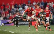 16 May 2025; Diarmuid Kilgallen of Munster is tackled by Rhyno Smith of Benetton Treviso during the United Rugby Championship match between Munster and Benetton at Virgin Media Park in Cork. Photo by Brendan Moran/Sportsfile