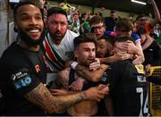 16 May 2025; Sean Maguire of Cork City, centre, celebrates with teammate and supporters after scoring his side's second goal, a penalty, during the SSE Airtricity Men's Premier Division match between St Patrick's Athletic and Cork City at Richmond Park in Dublin. Photo by Sam Barnes/Sportsfile