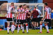 16 May 2025; Dom Thomas of Derry City, centre, celebrates with teammates after scoring their side's first goal during the SSE Airtricity Men's Premier Division match between Drogheda United and Derry City at Sullivan & Lambe Park in Drogheda, Louth. Photo by Ramsey Cardy/Sportsfile