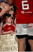 16 May 2025; Munster supporter Tadhg Daly, from Dungarvan in Waterford, watches as Peter O'Mahony of Munster signs autographs after the United Rugby Championship match between Munster and Benetton at Virgin Media Park in Cork. Photo by Brendan Moran/Sportsfile