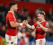 16 May 2025; Conor Murray, left, and Craig Casey of Munster celebrate at the final whistle of the United Rugby Championship match between Munster and Benetton at Virgin Media Park in Cork. Photo by Brendan Moran/Sportsfile