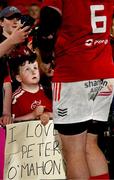 16 May 2025; Munster supporter Tadhg Daly, from Dungarvan in Waterford, watches as Peter O'Mahony of Munster signs autographs after the United Rugby Championship match between Munster and Benetton at Virgin Media Park in Cork. Photo by Brendan Moran/Sportsfile