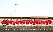 16 May 2025; The Munster team, from left, Peter O'Mahony, Thaakir Abrahams, John Hodnett, Craig Casey, Jack Crowley, Alex Nankivell, Diarmuid Kilgallen, Stephen Archer, Gavin Coombes, Michael Milne, Jean Kleyn, Tom Farrell, Calvin Nash, Niall Scannell and captain Tadhg Beirne stand for a minute's silence in memory of the Great Famine before the United Rugby Championship match between Munster and Benetton at Virgin Media Park in Cork. Photo by Brendan Moran/Sportsfile