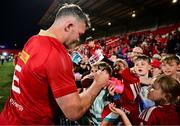 16 May 2025; Peter O'Mahony of Munster signs autographs after the United Rugby Championship match between Munster and Benetton at Virgin Media Park in Cork. Photo by Brendan Moran/Sportsfile