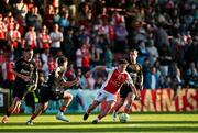 16 May 2025; Kian Leavy of St Patrick's Athletic in action against Charlie Lyons of Cork City during the SSE Airtricity Men's Premier Division match between St Patrick's Athletic and Cork City at Richmond Park in Dublin. Photo by Sam Barnes/Sportsfile