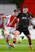 16 May 2025; Sean Murray of Cork City in action against Barry Baggley of St Patrick's Athletic during the SSE Airtricity Men's Premier Division match between St Patrick's Athletic and Cork City at Richmond Park in Dublin. Photo by Sam Barnes/Sportsfile