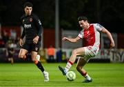 16 May 2025; Simon Power of St Patrick's Athletic in action against Freddie Anderson of Cork City during the SSE Airtricity Men's Premier Division match between St Patrick's Athletic and Cork City at Richmond Park in Dublin. Photo by Sam Barnes/Sportsfile