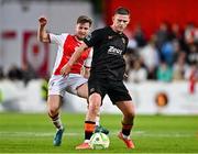 16 May 2025; Sean Murray of Cork City in action against Barry Baggley of St Patrick's Athletic during the SSE Airtricity Men's Premier Division match between St Patrick's Athletic and Cork City at Richmond Park in Dublin. Photo by Sam Barnes/Sportsfile
