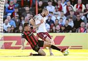 16 May 2025; Shelbourne goalkeeper Conor Kearns closed down by Dayle Rooney of Bohemians during the SSE Airtricity Men's Premier Division match between Bohemians and Shelbourne at Dalymount Park in Dublin. Photo by Seb Daly/Sportsfile