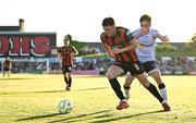16 May 2025; Dayle Rooney of Bohemians in action against James Norris of Shelbourne during the SSE Airtricity Men's Premier Division match between Bohemians and Shelbourne at Dalymount Park in Dublin. Photo by Seb Daly/Sportsfile