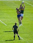 17 May 2025; Diarmuid O'Connor of Kerry gathers the kickout at the start of the second half ahead of Eddie Nolan of Roscommon, watched by referee David Coldrick, during the GAA Football All-Ireland Senior Championship Round 1 match between Kerry and Roscommon at Fitzgerald Stadium in Killarney, Kerry. Photo by Brendan Moran/Sportsfile