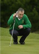 17 September 2004; Michael Halloran, Tralee Golf Club, lines up a putt on the 18th. Bulmers Pierce Purcell Shield Final, Ballinrobe Golf Club v Tralee Golf Club, Shannon Golf Club, Shannon, Co. Clare. Picture credit; Ray McManus / SPORTSFILE