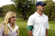 17 September 2004; Caroline Harrington pictured with Joey Harrington, who plays for the Detroit Lions Football team, during the Friday afternoon foursomes. 35th Ryder Cup Matches, Oakland Hills Country Club, Bloomfield Township, Michigan, USA. Picture credit; Matt Browne / SPORTSFILE