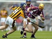 12 September 2004; Andrew Karey, Galway, in action against Pat Hartley, Kilkenny. All-Ireland Minor Hurling Championship Final, Galway v Kilkenny, Croke Park, Dublin. Picture credit; Brendan Moran / SPORTSFILE *** Local Caption *** Any photograph taken by SPORTSFILE during, or in connection with, the 2004 Guinness All-Ireland Hurling Final which displays GAA logos or contains an image or part of an image of any GAA intellectual property, or, which contains images of a GAA player/players in their playing uniforms, may only be used for editorial and non-advertising purposes.  Use of photographs for advertising, as posters or for purchase separately is strictly prohibited unless prior written approval has been obtained from the Gaelic Athletic Association.