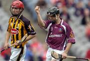 12 September 2004; Kerril Wade, Galway, celebrates scoring his sides first goal as James Maher, Kilkenny, looks on. All-Ireland Minor Hurling Championship Final, Galway v Kilkenny, Croke Park, Dublin. Picture credit; Brendan Moran / SPORTSFILE *** Local Caption *** Any photograph taken by SPORTSFILE during, or in connection with, the 2004 Guinness All-Ireland Hurling Final which displays GAA logos or contains an image or part of an image of any GAA intellectual property, or, which contains images of a GAA player/players in their playing uniforms, may only be used for editorial and non-advertising purposes.  Use of photographs for advertising, as posters or for purchase separately is strictly prohibited unless prior written approval has been obtained from the Gaelic Athletic Association.