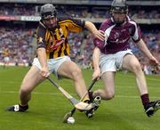 12 September 2004; Kieran Joyce, Kilkenny, in action against Barry Hanley, Galway. All-Ireland Minor Hurling Championship Final, Galway v Kilkenny, Croke Park, Dublin. Picture credit; Brendan Moran / SPORTSFILE *** Local Caption *** Any photograph taken by SPORTSFILE during, or in connection with, the 2004 Guinness All-Ireland Hurling Final which displays GAA logos or contains an image or part of an image of any GAA intellectual property, or, which contains images of a GAA player/players in their playing uniforms, may only be used for editorial and non-advertising purposes.  Use of photographs for advertising, as posters or for purchase separately is strictly prohibited unless prior written approval has been obtained from the Gaelic Athletic Association.