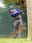 17 September 2004; Tiger Woods, Team Europe 2004, plays from the rough off the 18th fairway after he had to take a penalty drop during the Friday afternoon foursomes. 35th Ryder Cup Matches, Oakland Hills Country Club, Bloomfield Township, Michigan, USA. Picture credit; Matt Browne / SPORTSFILE