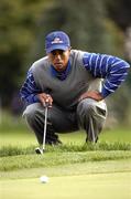 17 September 2004; Tiger Woods, Team USA 2004, lines up a putt on the 18th green during the Friday afternoon foursomes. 35th Ryder Cup Matches, Oakland Hills Country Club, Bloomfield Township, Michigan, USA. Picture credit; Matt Browne / SPORTSFILE
