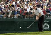 17 September 2004; Lee Westwood, Team Europe 2004, pitches onto the 18th green during the Friday afternoon foursome. 35th Ryder Cup Matches, Oakland Hills Country Club, Bloomfield Township, Michigan, USA. Picture credit; Matt Browne / SPORTSFILE