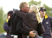 17 September 2004; Darren Clarke, Team Europe 2004, gets a kiss from his wife Heather on the 18th green after the win against Woods and Mickleson during the Friday afternoon foursomes. 35th Ryder Cup Matches, Oakland Hills Country Club, Bloomfield Township, Michigan, USA. Picture credit; Matt Browne / SPORTSFILE