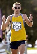 18 September 2004; Gary Crossan, Letterkenny, crosses the finish line to win the adidas BHAA Dublin half-marathon. Phoenix Park, Dublin. Picture credit; Brian Lawless / SPORTSFILE