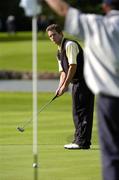 18 September 2004; Clancy Bowe, Tramore Golf Club, watches his putt on the 8th green. Bulmers Senior Cup Final, Tramore Golf Club v Ballyclare Golf Club, Shannon Golf Club, Shannon, Co. Clare. Picture credit; Ray McManus / SPORTSFILE