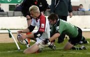 18 September 2004; Tommy Bowe, Ulster, holds off the challenge from Conor McPhillips, Connacht, to score his a try for his side. Celtic League 2004-2005, Connacht v Ulster, Sportsground, Galway. Picture credit; David Maher / SPORTSFILE