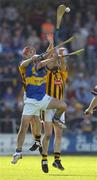 18 September 2004; Tommy Walsh, Kilkenny, goes up for a high ball with Wayne Cully, Tipperary. Erin All-Ireland U21 Hurling Championship Final, Kilkenny v Tipperary, Nowlan Park, Kilkenny. Picture credit; Damien Eagers / SPORTSFILE