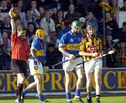 18 September 2004; Tipperary's Tony Scroppe, green helmet, is shown the red card by referee Barry Kelly. Erin All-Ireland U21 Hurling Championship Final, Kilkenny v Tipperary, Nowlan Park, Kilkenny. Picture credit; Damien Eagers / SPORTSFILE